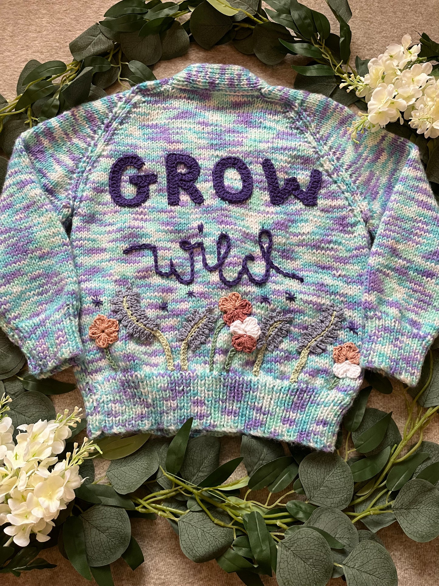 Size 3-5 Years, Grow Wild, Hand knitted Cardigan, Purple/ Blue/ White Fleck, Pocket Flowers