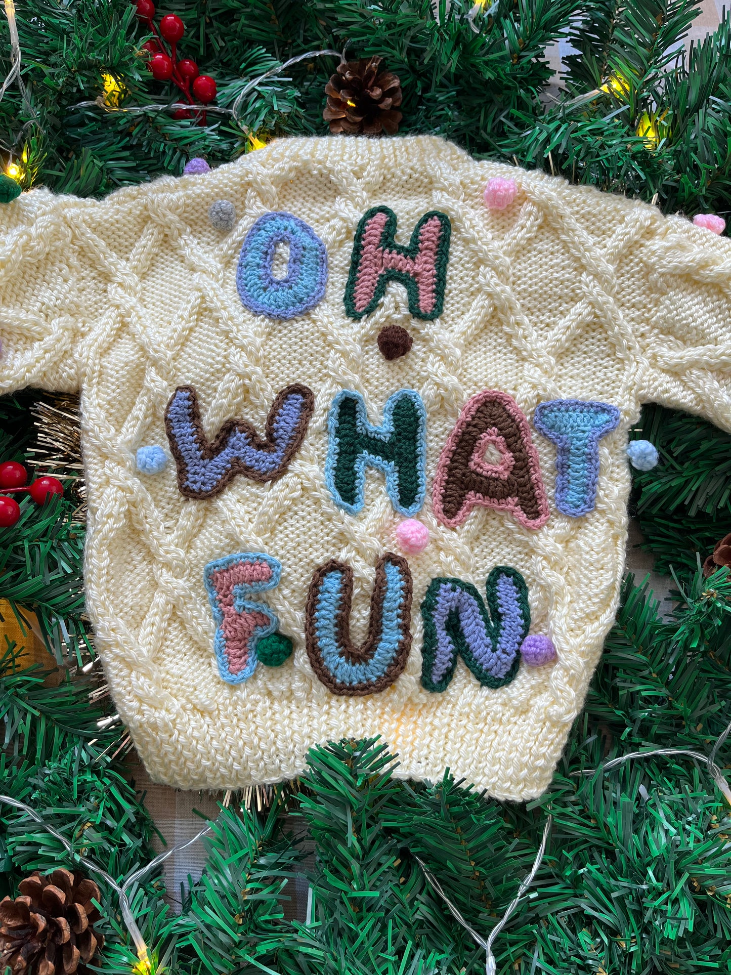 Size 1-2 years, Oh what fun, Cream Hand Knit Jumper with Pom Poms