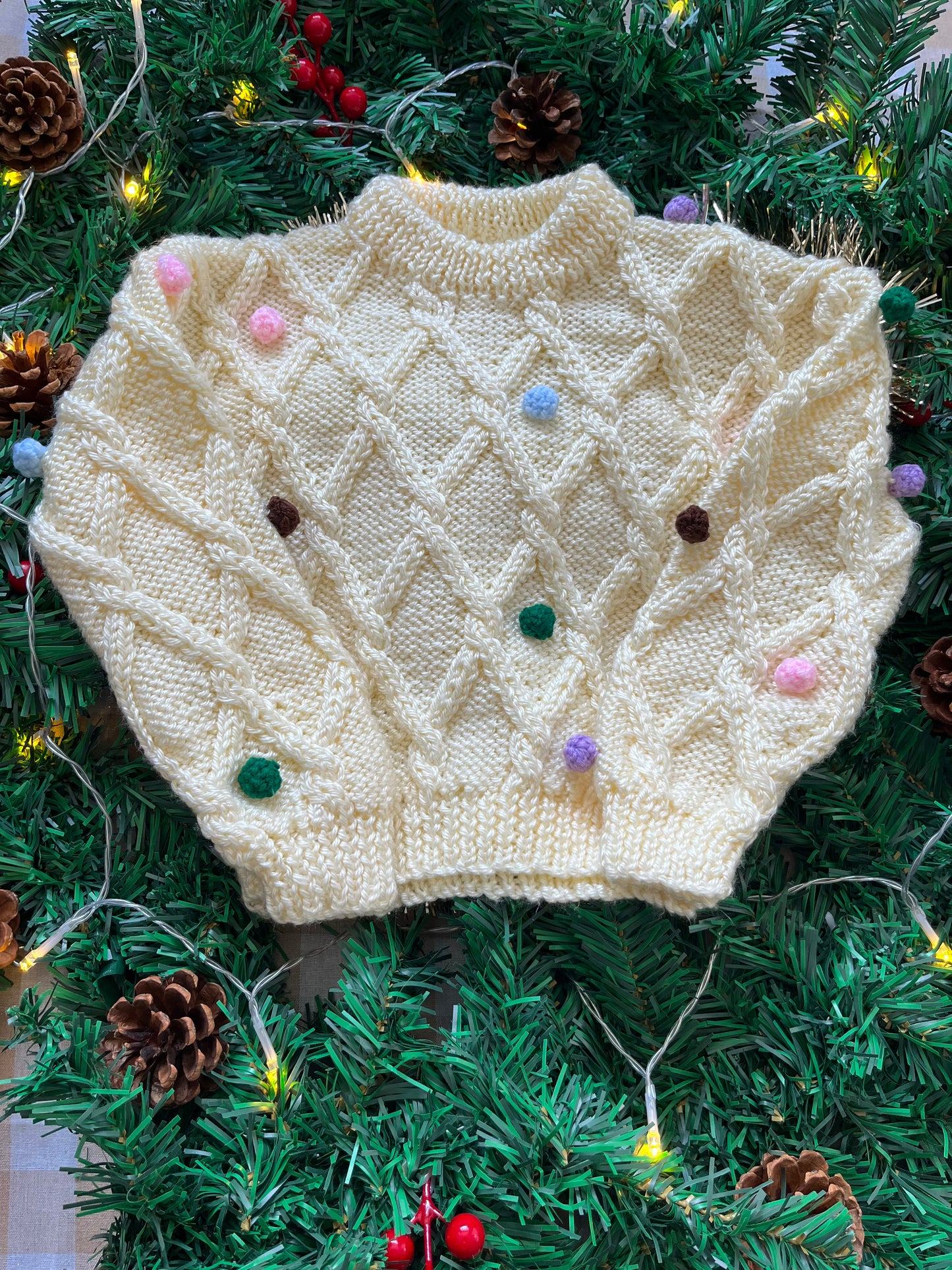 Size 1-2 years, Oh what fun, Cream Hand Knit Jumper with Pom Poms