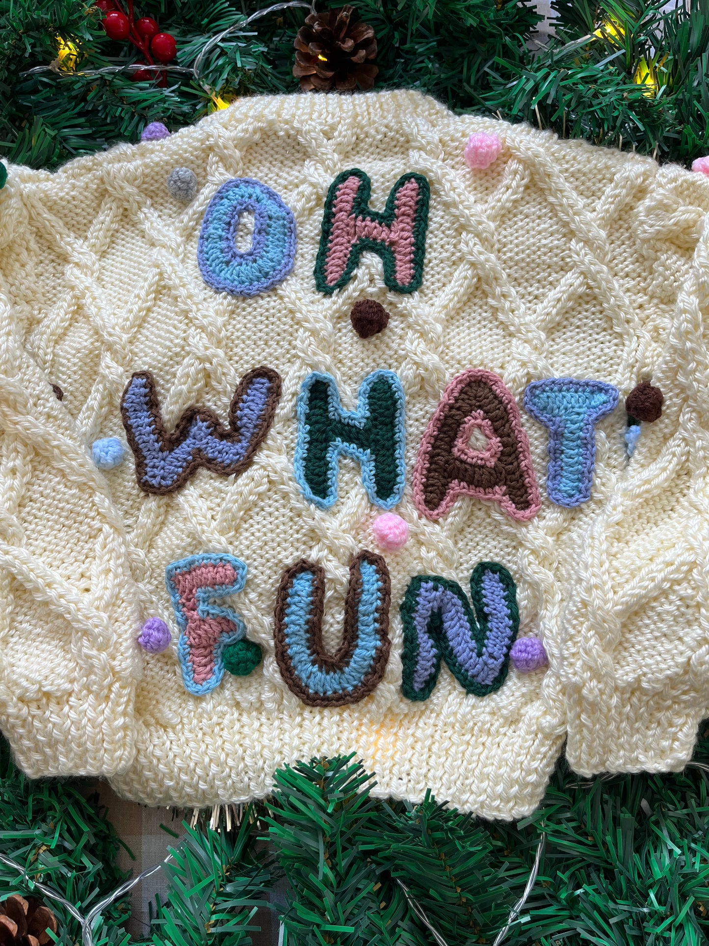 Size 1-2 years, Oh what fun, Cream Hand Knit Jumper with Pom Poms