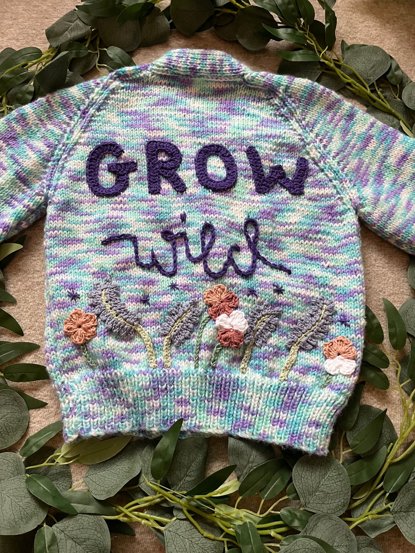 Size 3-5 Years, Grow Wild, Hand knitted Cardigan, Purple/ Blue/ White Fleck, Pocket Flowers