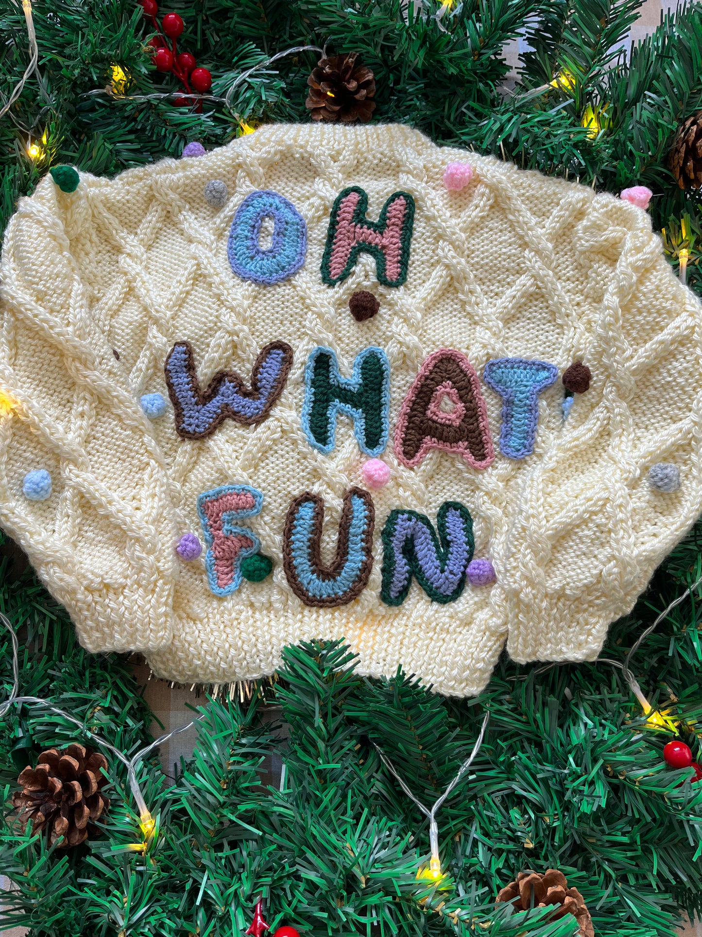 Size 1-2 years, Oh what fun, Cream Hand Knit Jumper with Pom Poms