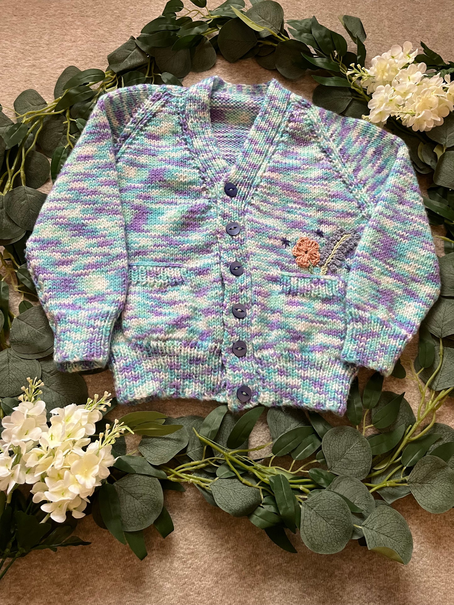 Size 3-5 Years, Grow Wild, Hand knitted Cardigan, Purple/ Blue/ White Fleck, Pocket Flowers