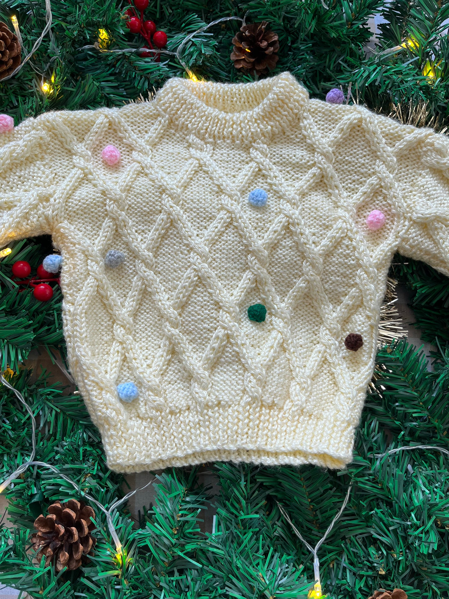 Size 1-2 years, Oh what fun, Cream Hand Knit Jumper with Pom Poms