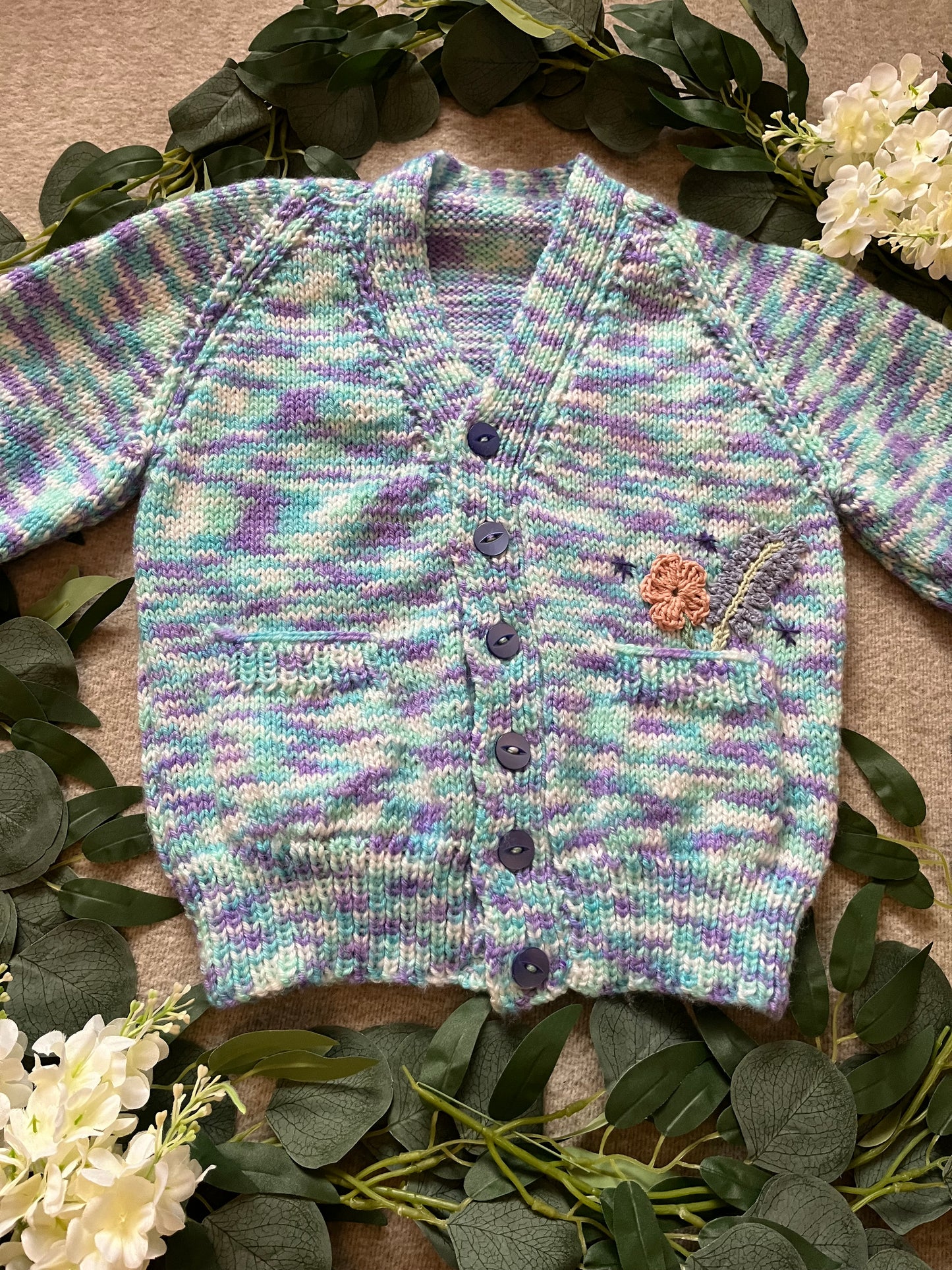 Size 3-5 Years, Grow Wild, Hand knitted Cardigan, Purple/ Blue/ White Fleck, Pocket Flowers