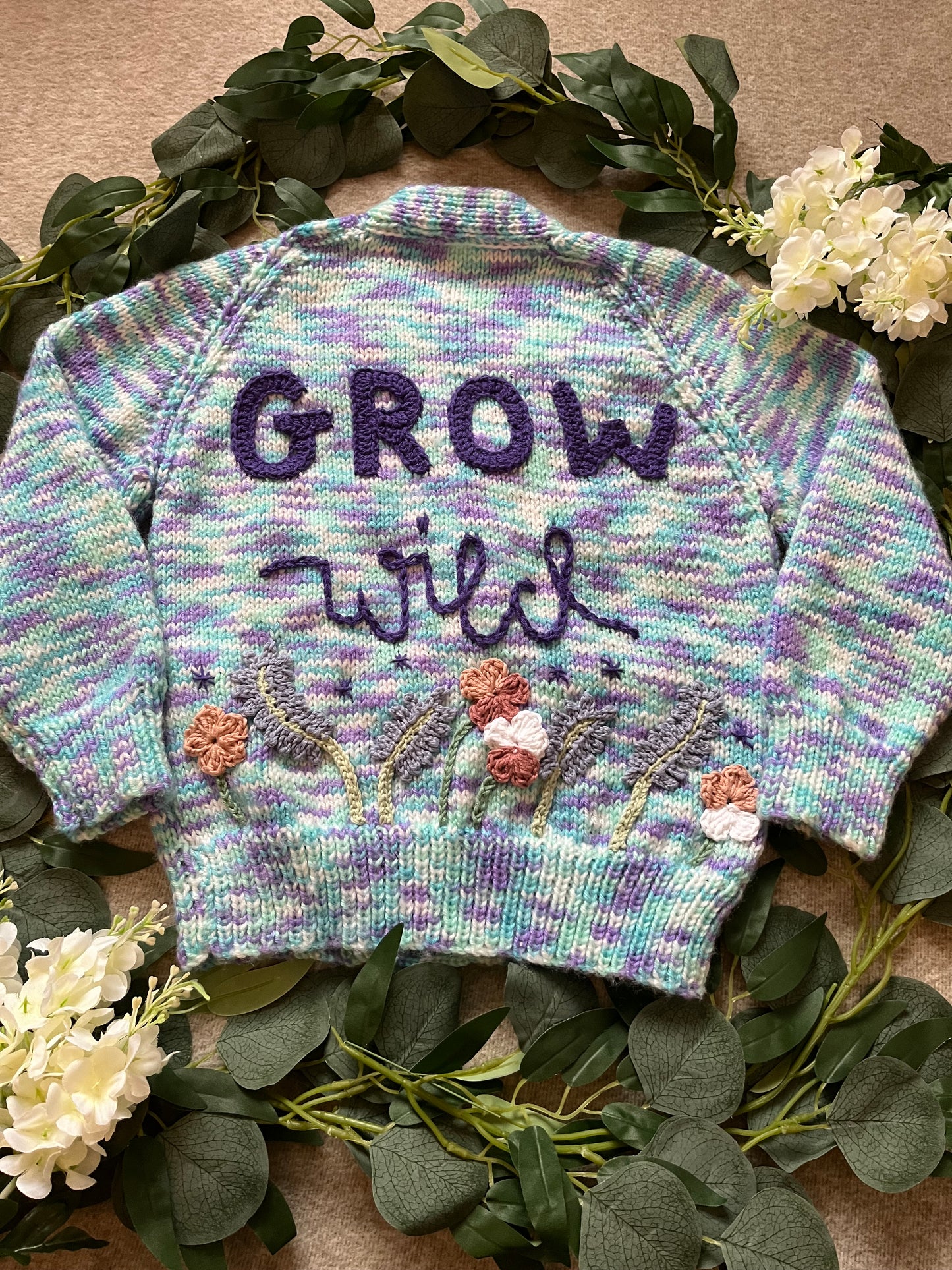 Size 3-5 Years, Grow Wild, Hand knitted Cardigan, Purple/ Blue/ White Fleck, Pocket Flowers