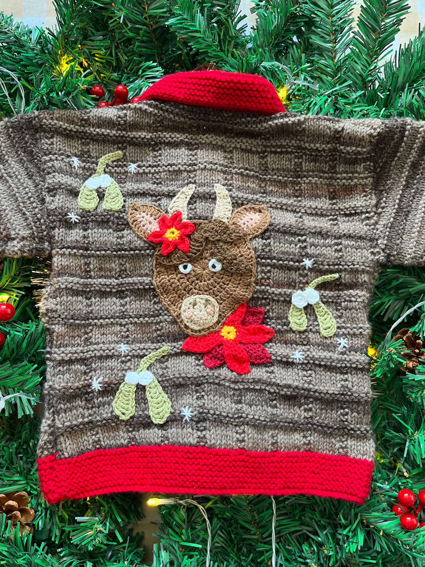 Size 2-3 years, Christmas Cow Cardi, Brown with a red trim.