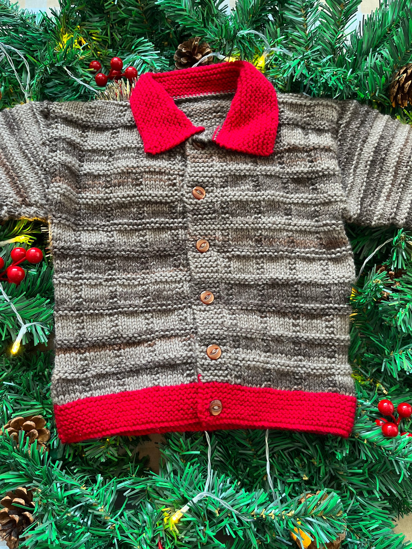Size 2-3 years, Christmas Cow Cardi, Brown with a red trim.