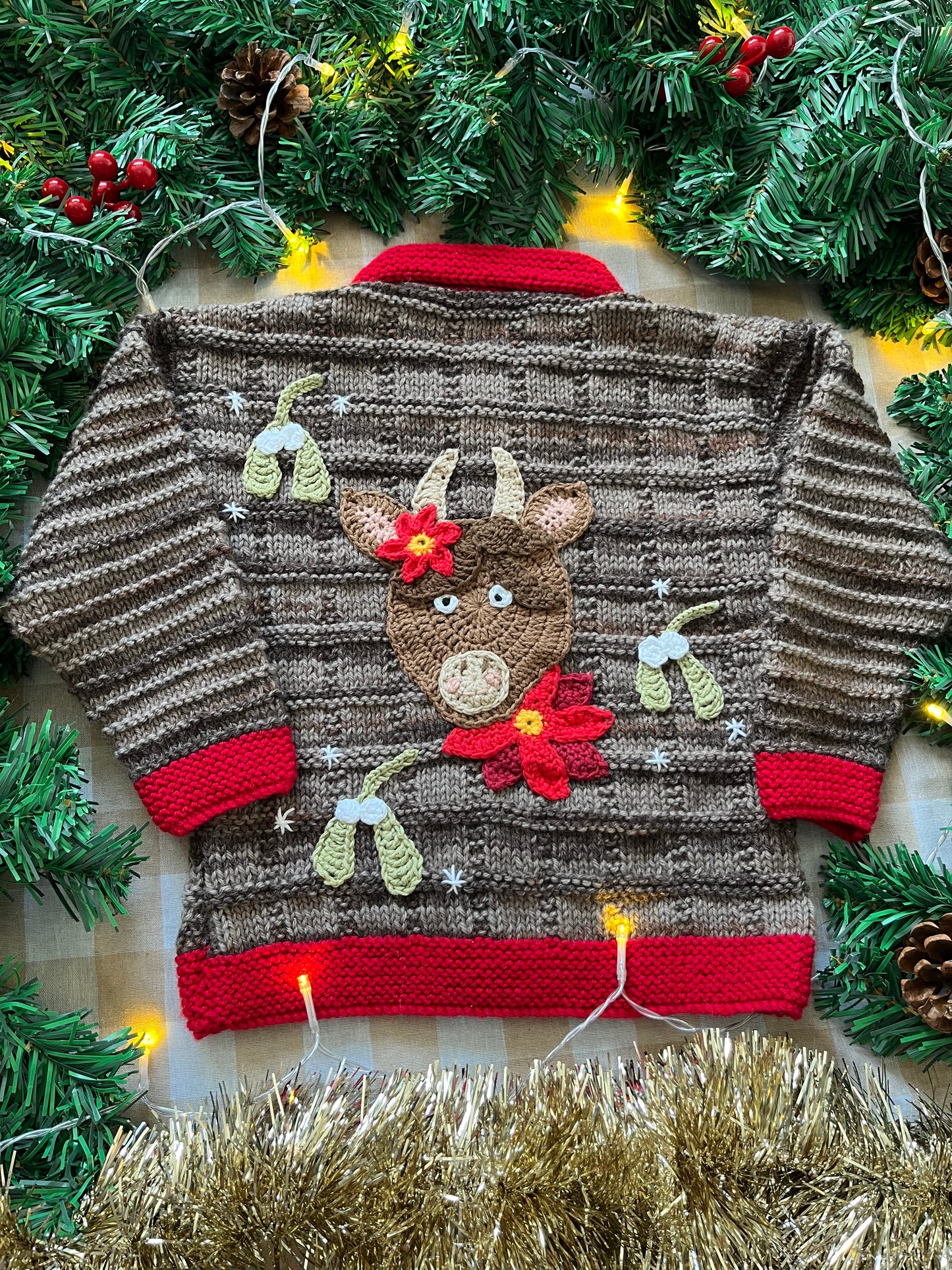 Size 2-3 years, Christmas Cow Cardi, Brown with a red trim.