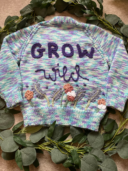 Size 3-5 Years, Grow Wild, Hand knitted Cardigan, Purple/ Blue/ White Fleck, Pocket Flowers